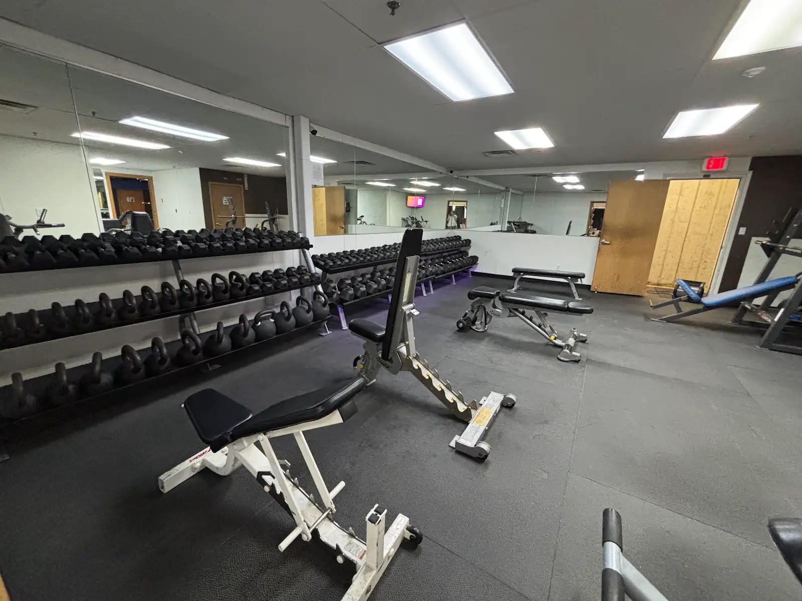 Dumbbell and kettlebell training area inside UGF Rapid Valley